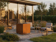 CUBY Feuergrill aus Cortenstahl auf Terrasse mit Lounge und Beleuchtung