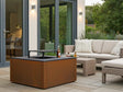 CUBY Feuergrill aus Cortenstahl auf Terrasse mit Lounge und Nutzungssituation