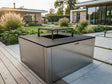 CUBY Feuergrill aus verzinktem Stahl im stilvollen Designgarten mit Terrasse