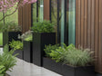 Pflanzkästen aus schwarzem Stahl in verschiedenen Höhen mit Sträuchern und Farnen